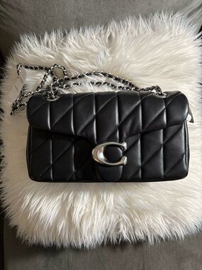 Coach Black Quilted Shoulder Bag with Silver 'C' Lock
Tabby 26